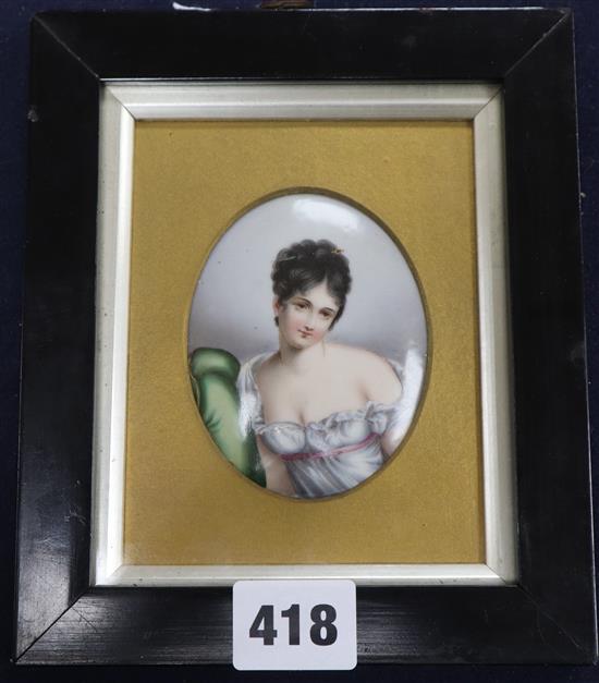 A 19th century German enamelled porcelain miniature of a coquettish young lady, 8 x 6.5cm